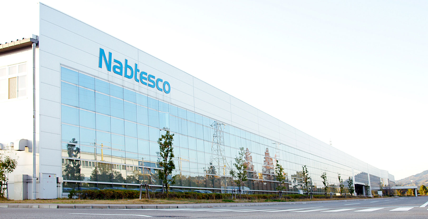 Nabtesco plant building with a long glass facade